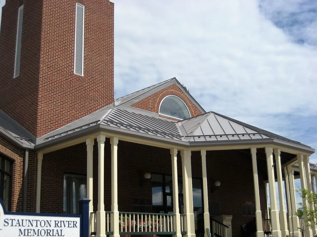 Skilled roofing craftsmen working on a residential roof in Pennsuco